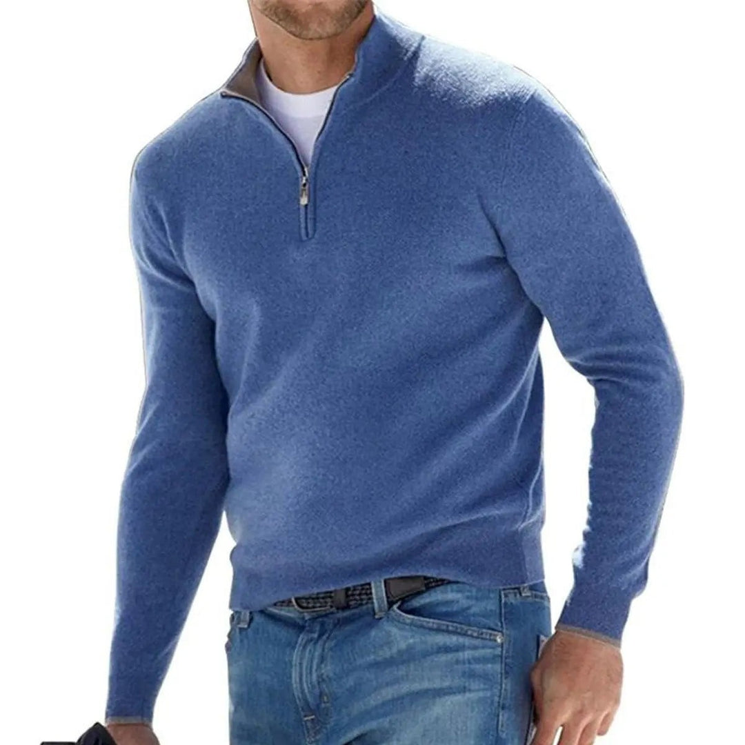 Blue ribbed quarter-zip pullover jumper worn with denim jeans