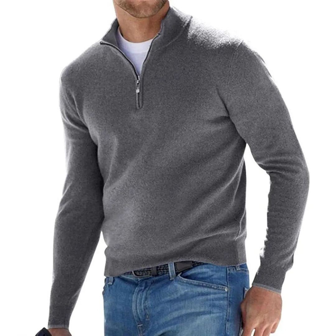 Grey ribbed quarter-zip jumper paired with classic denim jeans
