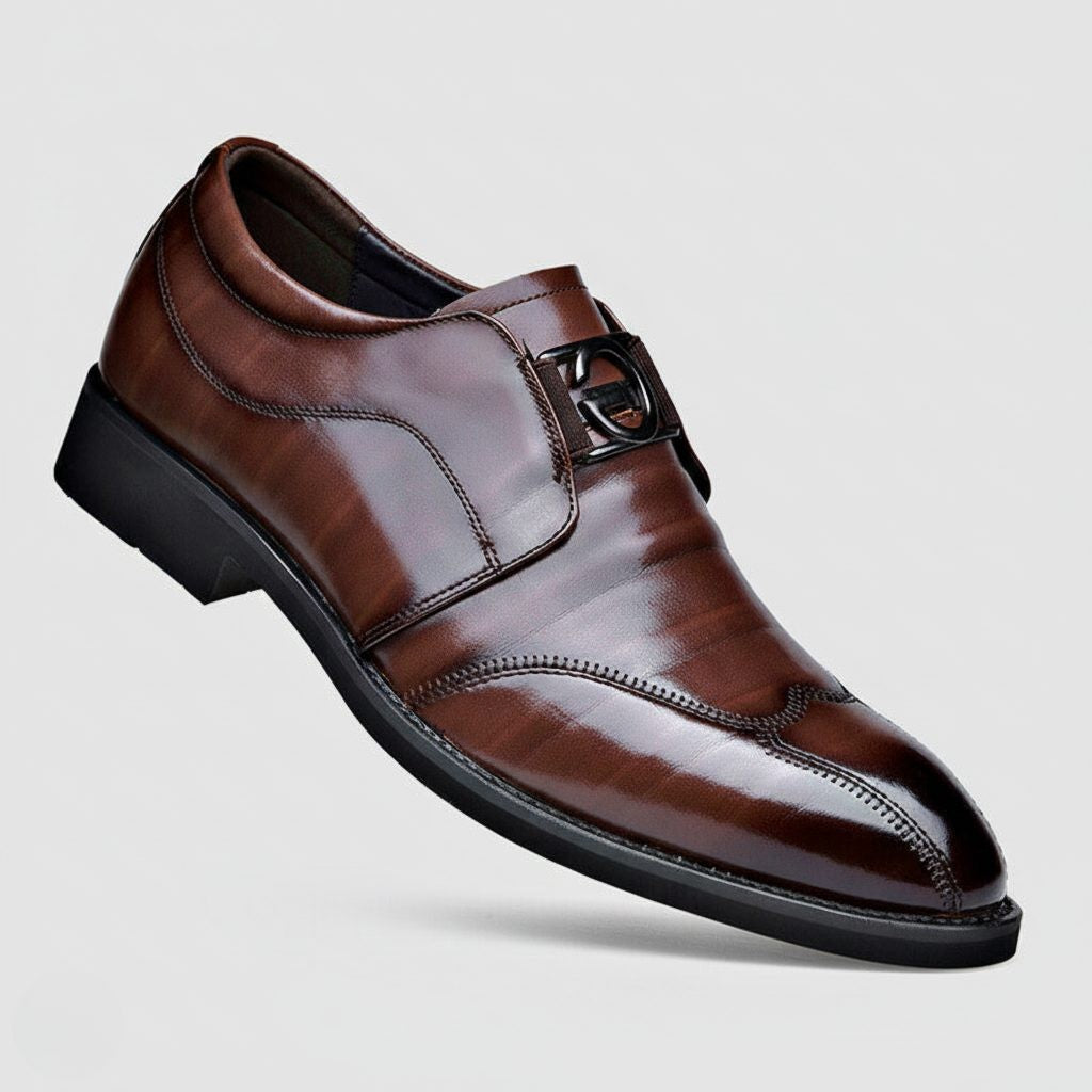 Brown leather monk strap shoe with pointed toe and buckle detail