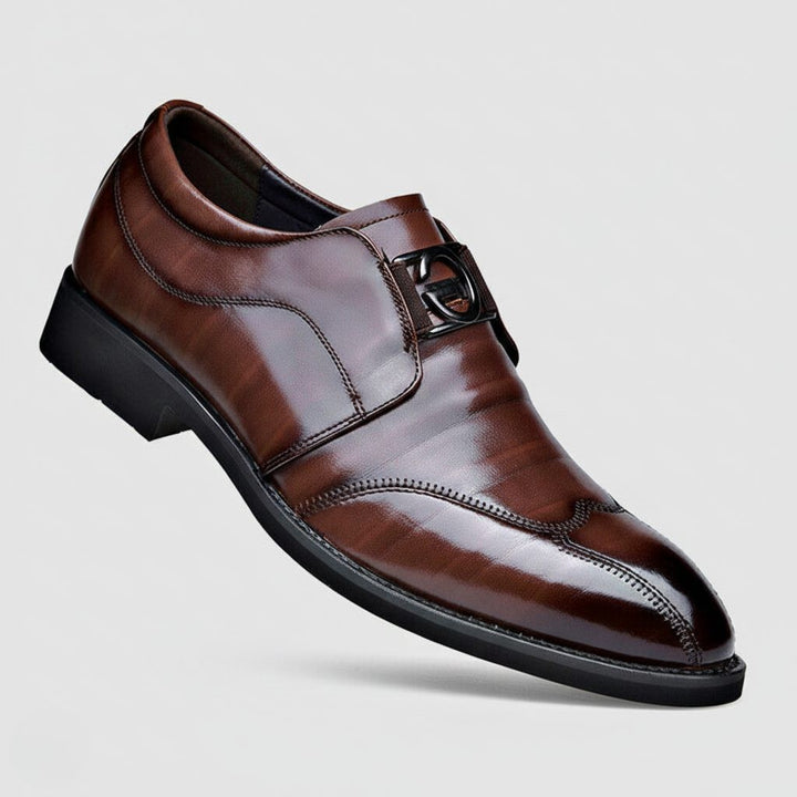 Brown leather monk strap shoe with pointed toe and buckle detail