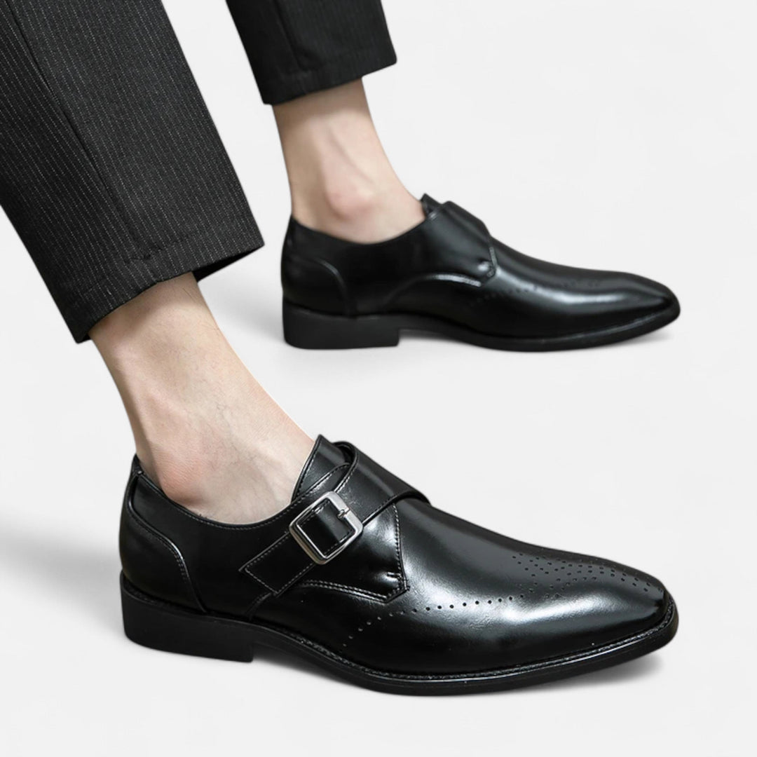 Man wearing black leather monk strap dress shoes with tailored trousers