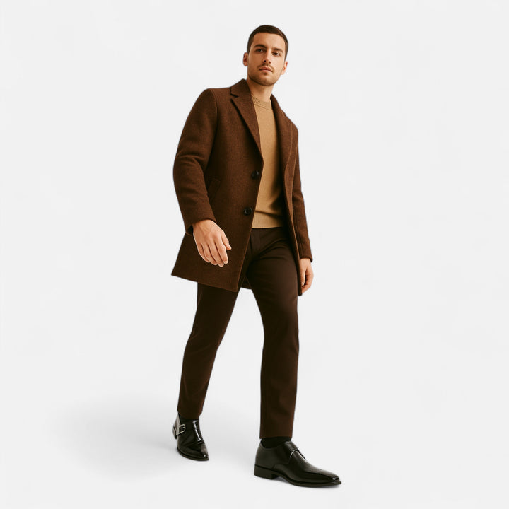 Man in brown wool coat styled with black leather monk strap dress shoes
