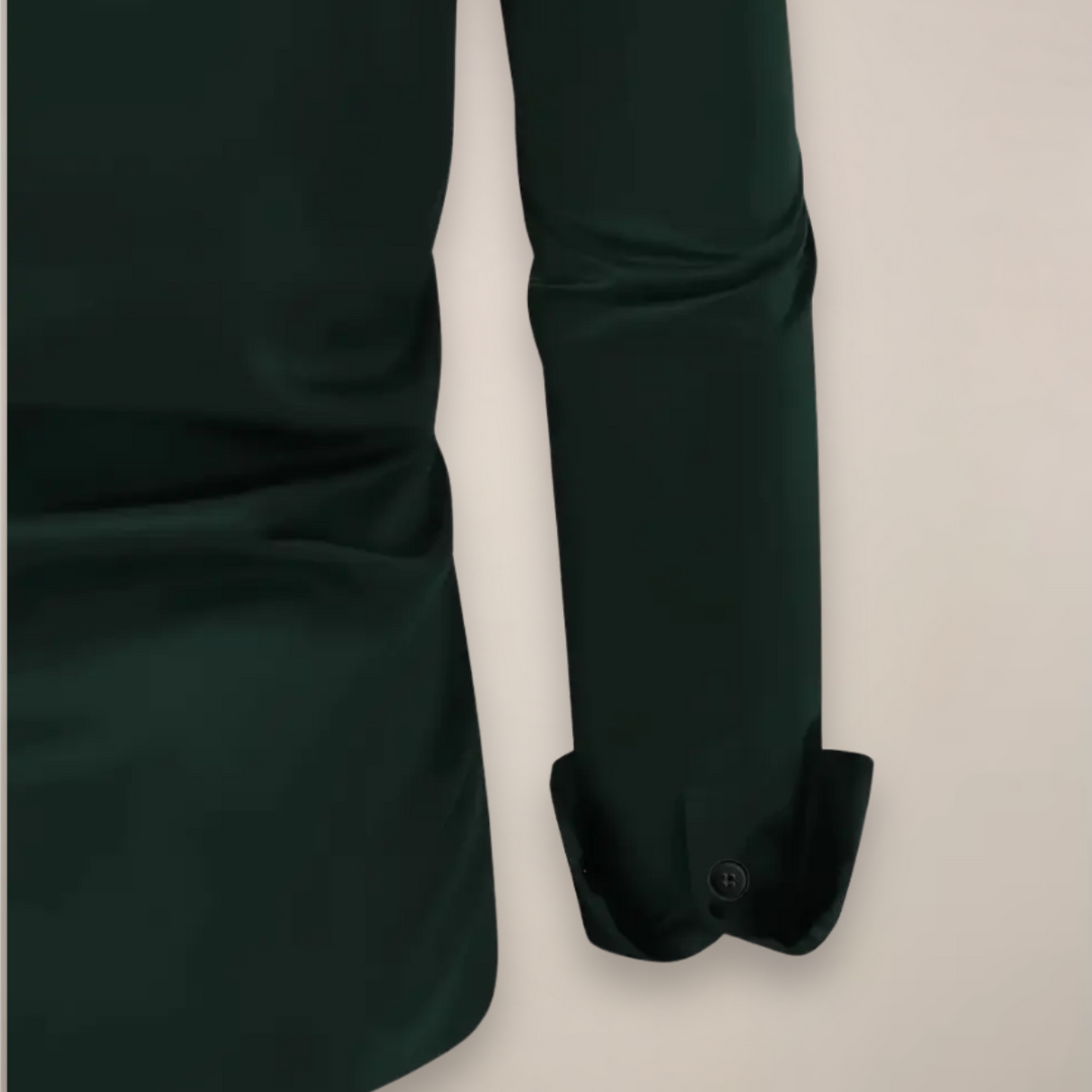 Close-up of dark green shirt cuff and hem with button fastening