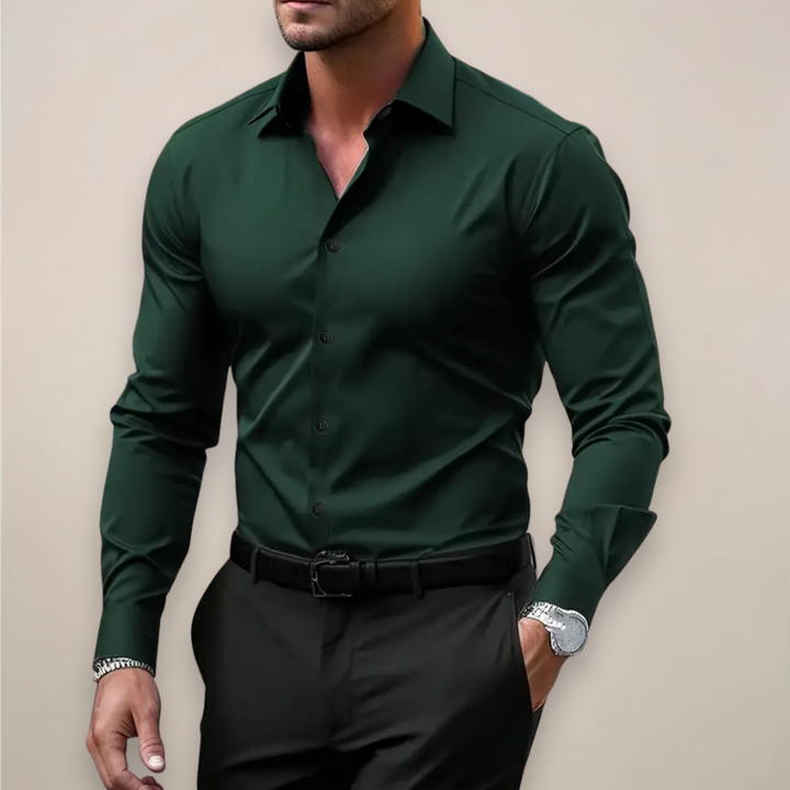 Dark green long sleeve men's shirt styled with black trousers and belt