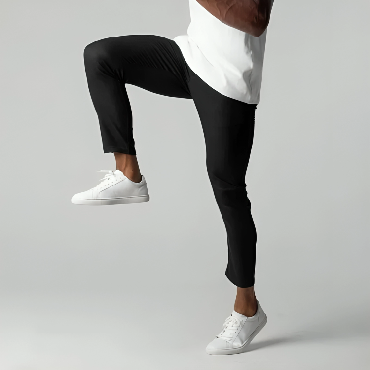 Man striding in black skinny-fit chinos paired with white trainers