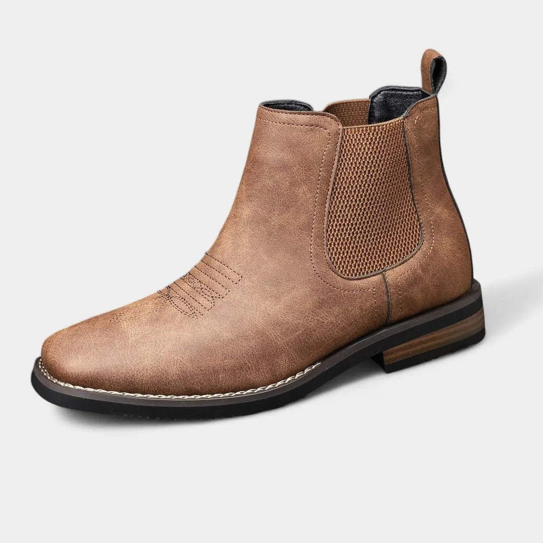 Tan leather Chelsea boot with western stitching and elastic side panel