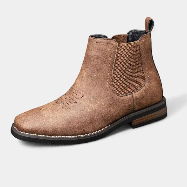 Tan leather Chelsea boot with western stitching and elastic side panel