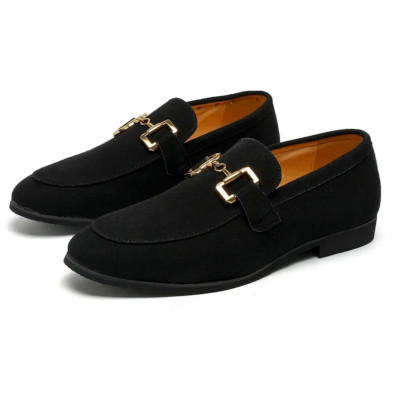 Black suede slip-on loafers with polished gold buckle, shown side by side