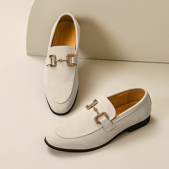 Ivory suede loafers with gold buckle trim, displayed as a matching pair