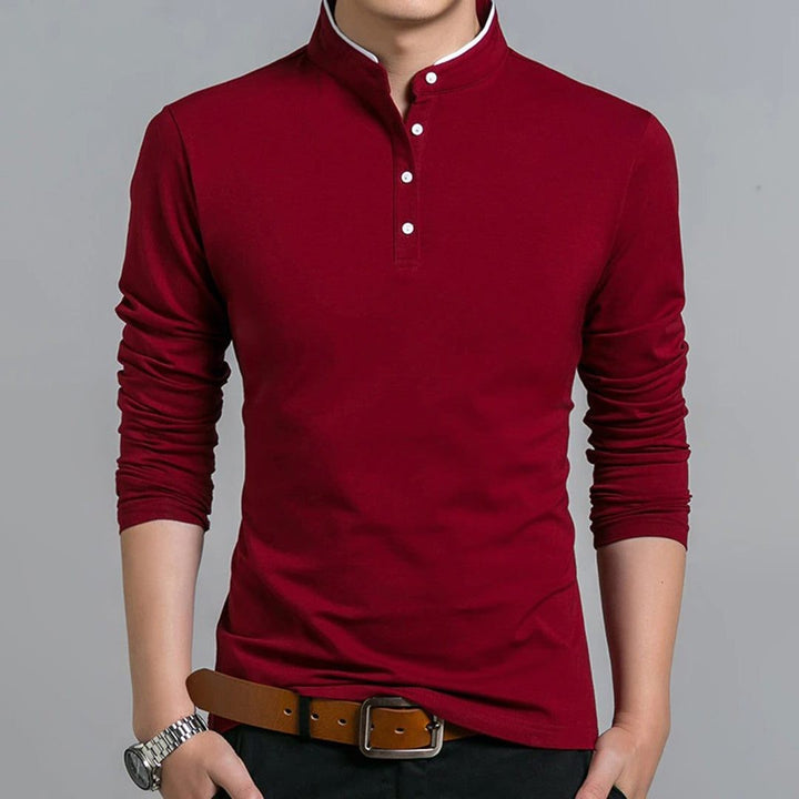 Burgundy long-sleeve polo shirt featuring stand collar and white buttons