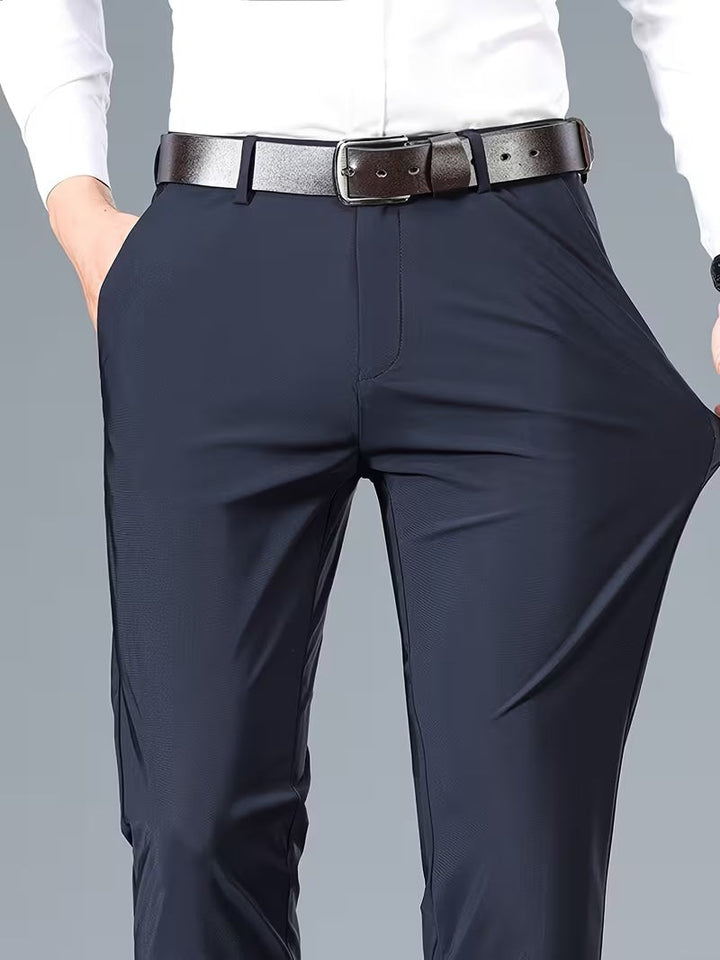 Navy stretch trousers close-up highlighting stretchable fabric and slim tailored fit