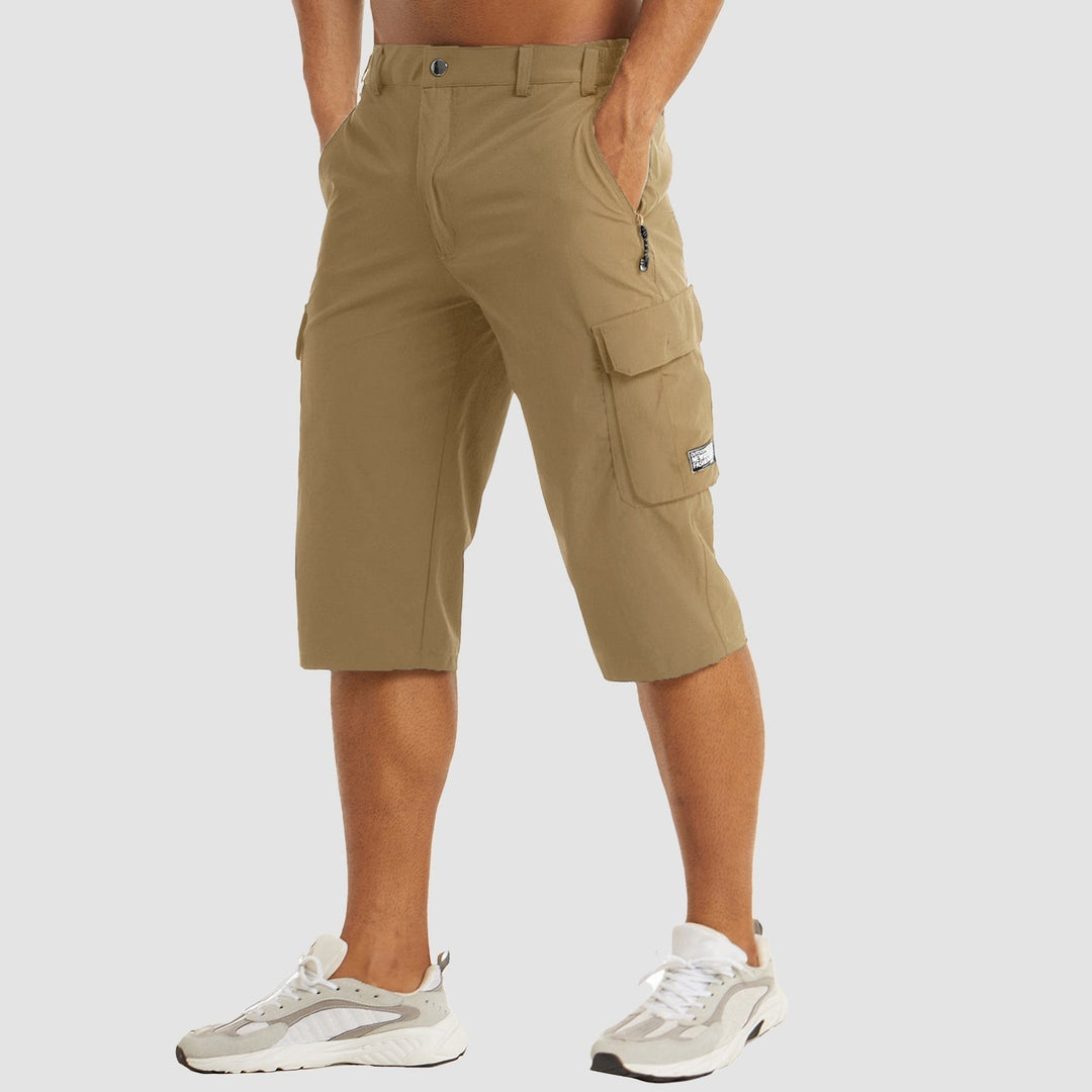 Khaki three-quarter length cargo shorts with zip pocket and popper waistband