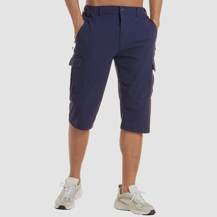 Navy stretch cargo shorts shown from side angle with multiple cargo pockets