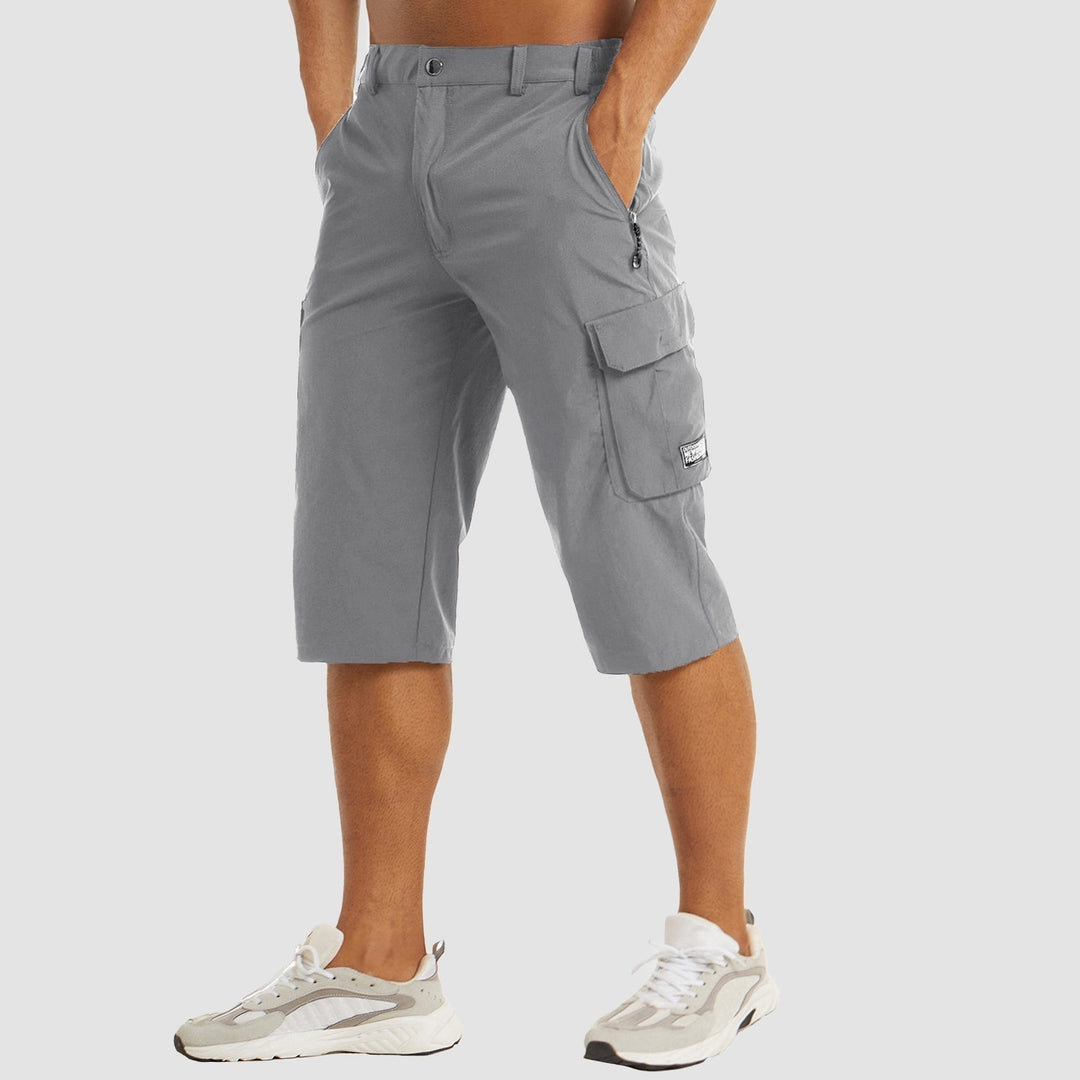 Grey stretch-fit cargo shorts worn with white trainers, side pocket detail