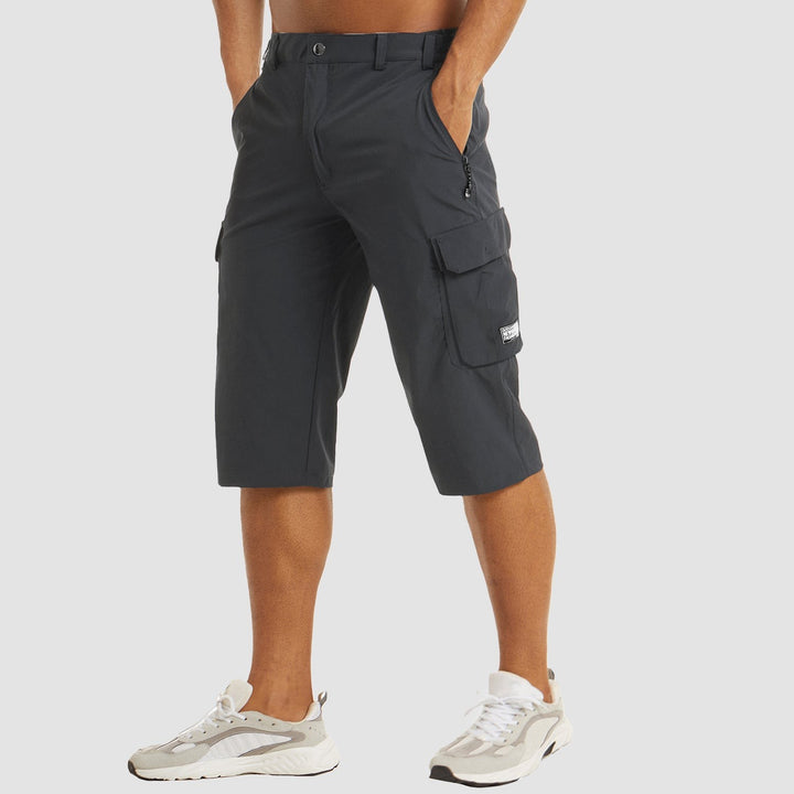 Charcoal grey cropped cargo shorts featuring flap pocket and belt loops