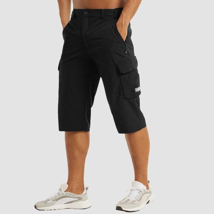 Black three-quarter cargo shorts with zipped side pocket and button fastening