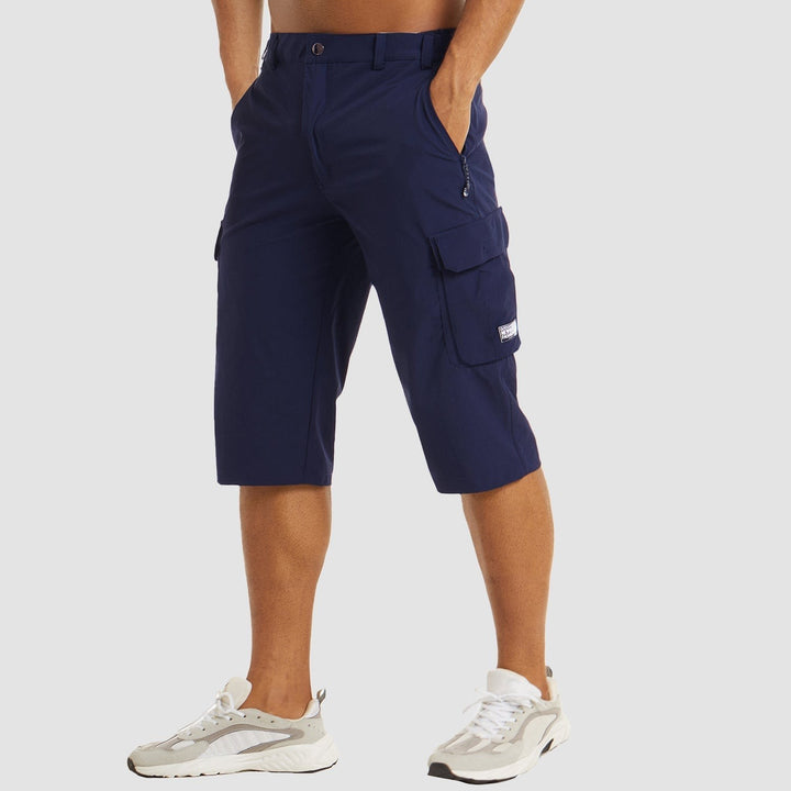 Navy blue cropped cargo shorts with popper waistband, front view on model