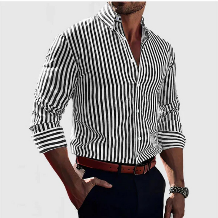 Black and white striped long-sleeve shirt styled with navy trousers