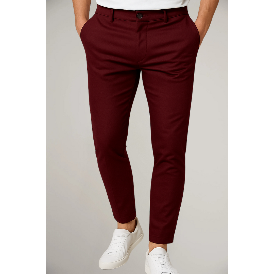 Burgundy tailored slim leg trousers styled with white t-shirt and trainers