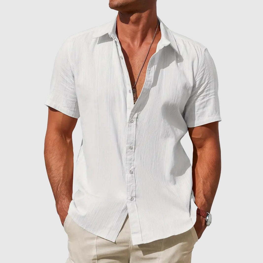 White textured linen short-sleeve shirt with classic collar, worn casually