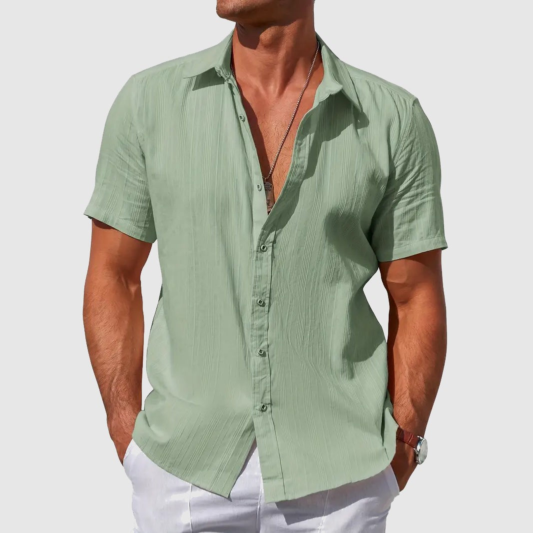 Sage green short-sleeve linen shirt with subtle woven texture
