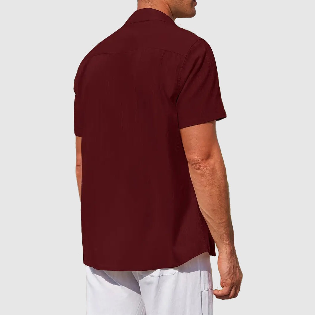 Rear view of burgundy linen shirt showing relaxed short-sleeve fit