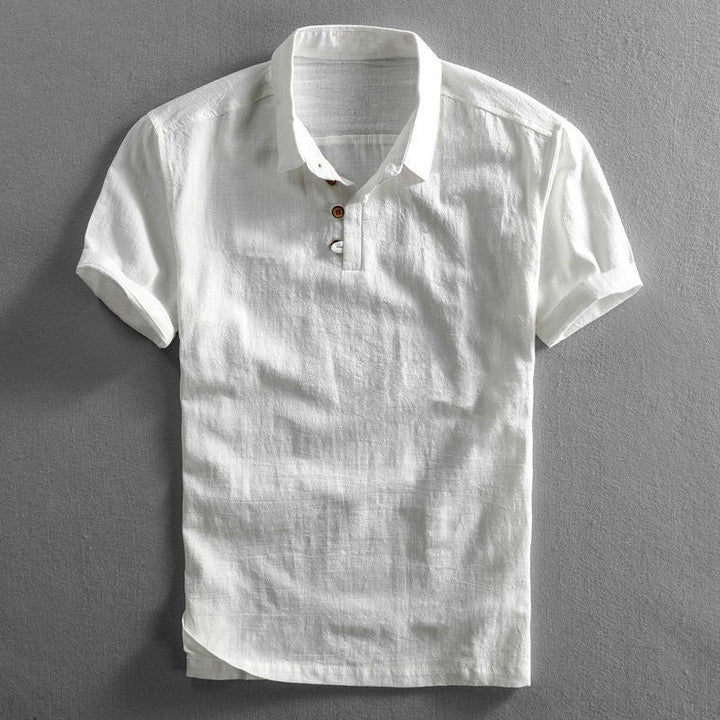 White linen short sleeve polo shirt with textured weave and button neckline
