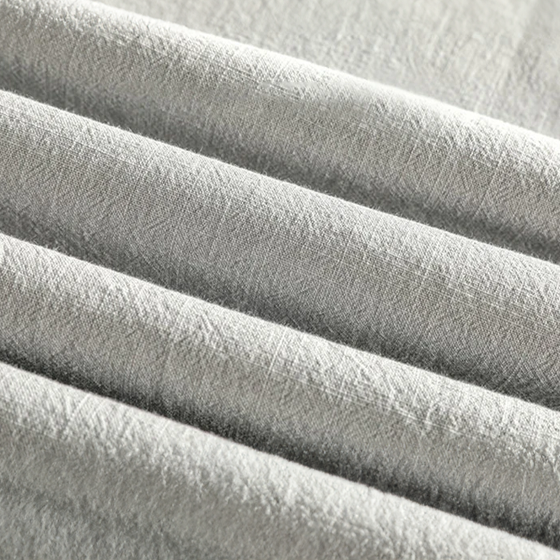 Textured grey linen fabric detail showing lightweight woven material