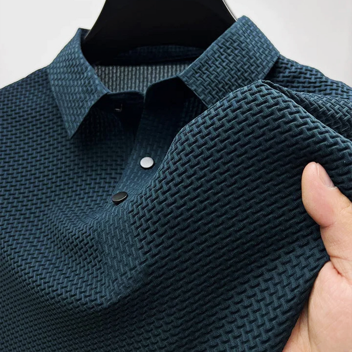 Navy men's polo shirt with textured fabric and contrast popper buttons