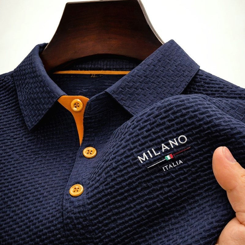 Navy textured polo shirt with tan button placket and Milano Italia branding