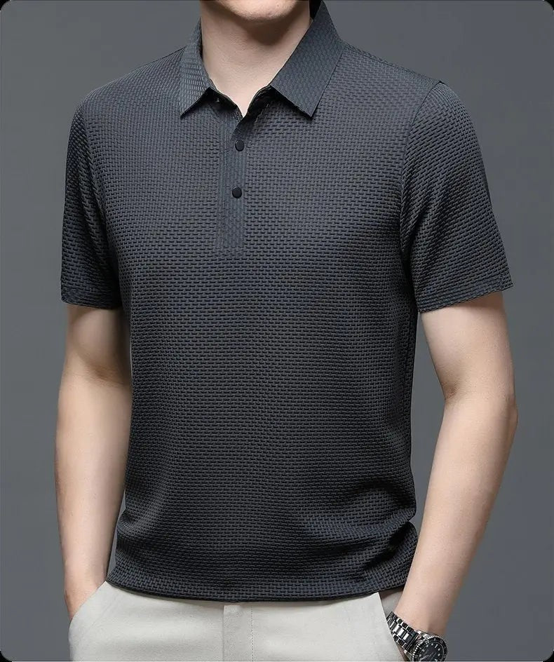 Charcoal grey textured knit polo shirt with short sleeves and button placket