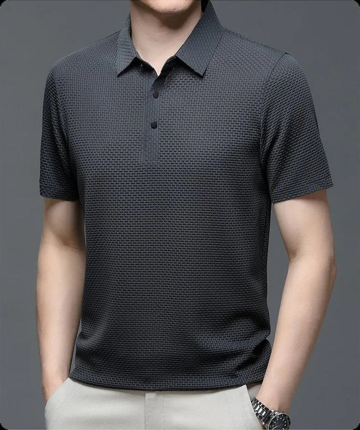 Charcoal grey textured knit polo shirt with short sleeves and button placket