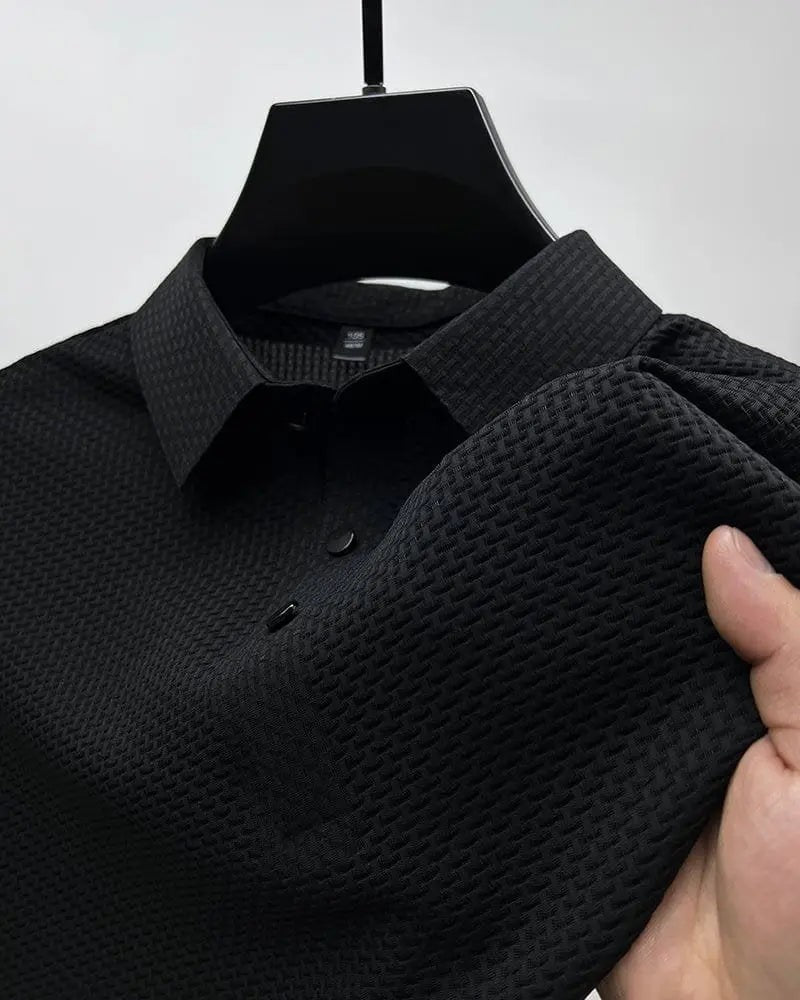 Black textured knit polo shirt on hanger with close-up fabric detail
