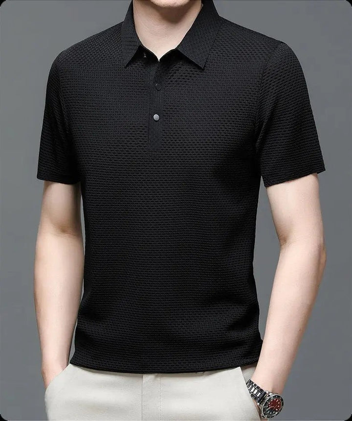 Black textured knit polo shirt featuring short sleeves and button neckline