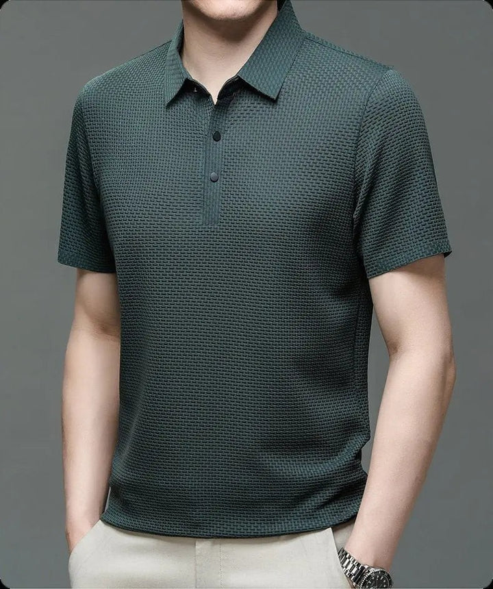 Forest green textured knit polo shirt with short sleeves on model