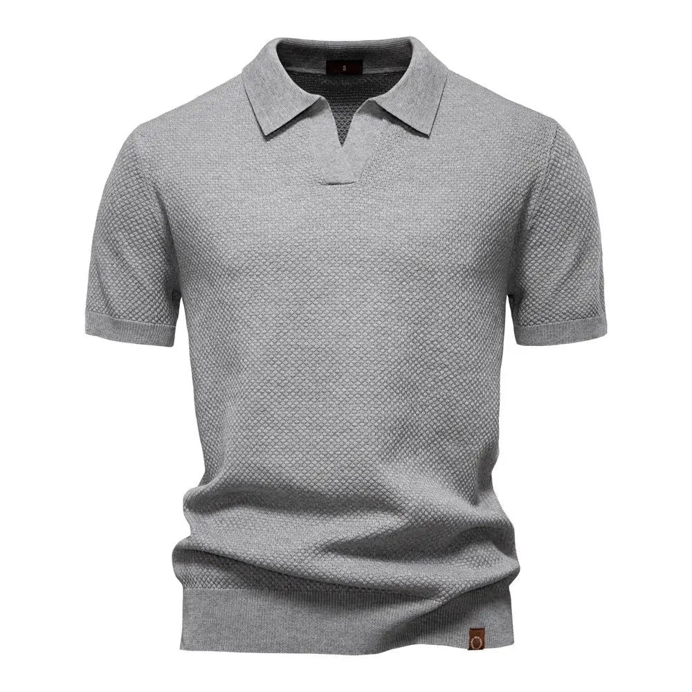 Grey textured knit polo shirt with buttonless V-neck and short sleeves