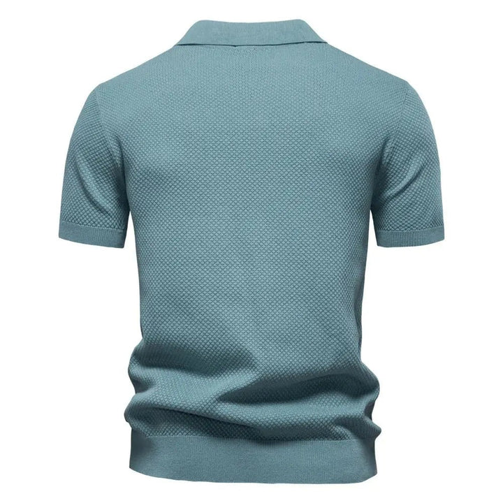 Rear view of duck egg blue textured polo shirt with collar detail
