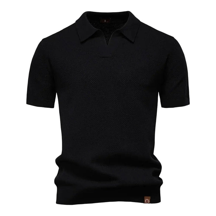 Black textured knit polo shirt featuring collared buttonless V-neck design