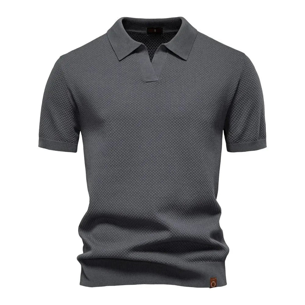 Charcoal grey knitted polo shirt with short sleeves and open collar