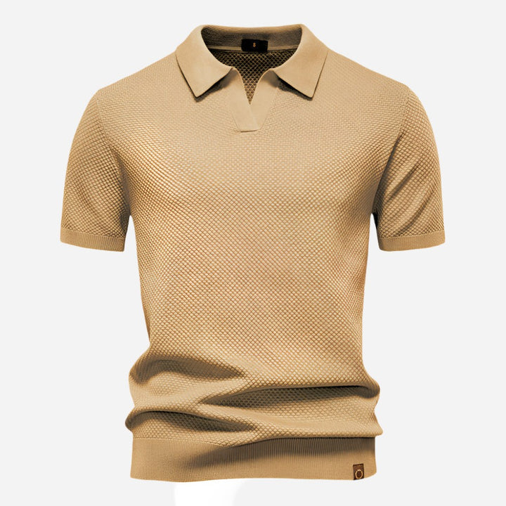 Beige knit polo shirt showing subtle woven diamond pattern