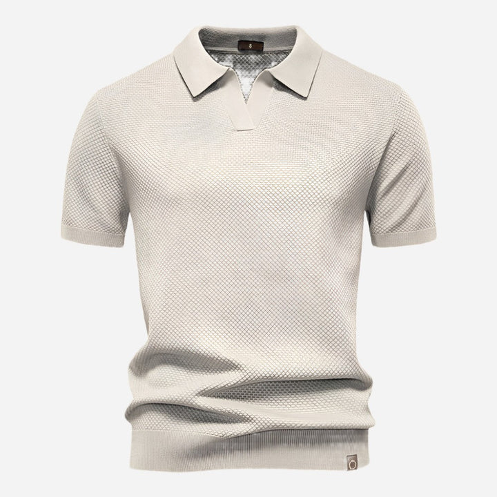 Cream textured knit polo shirt with open collar and short sleeves