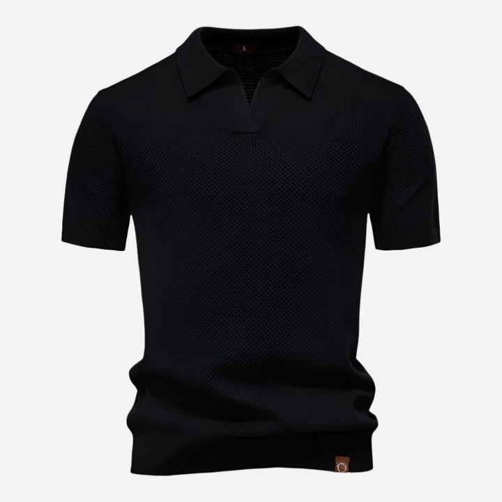 Black textured knit polo shirt with short sleeves and collar