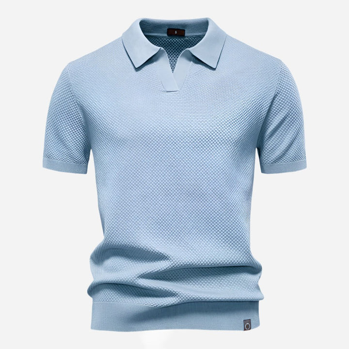 Pale blue knitted polo shirt with textured fabric and collar