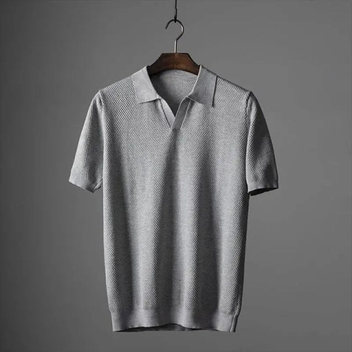 Grey textured knit polo shirt featuring a V-neck open collar design