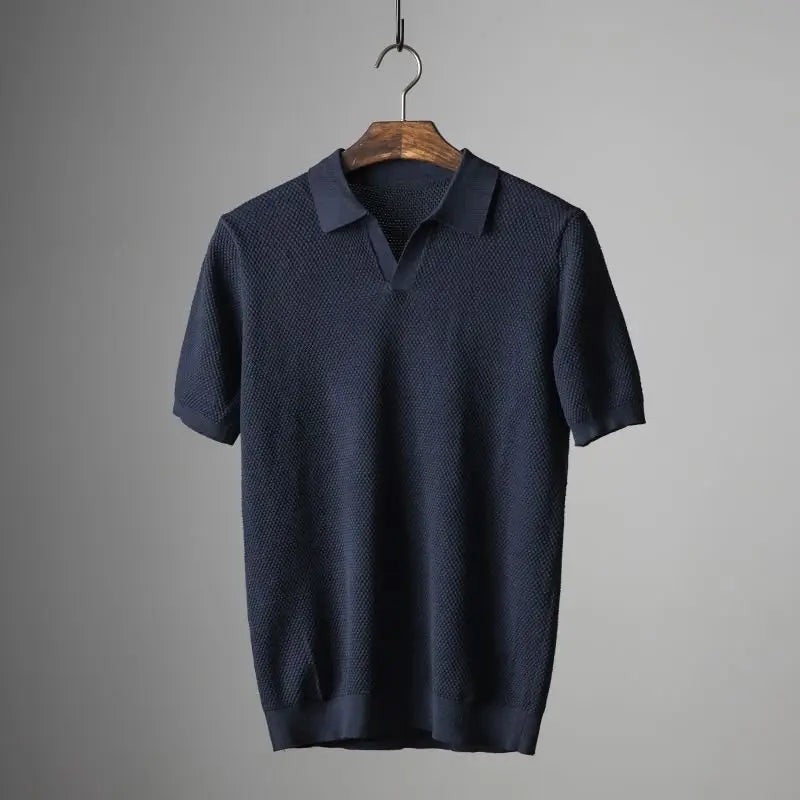 Navy textured knit polo shirt with geometric weave and open collar