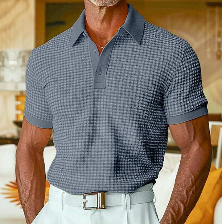 Navy waffle-textured polo shirt with buttoned placket and short sleeves