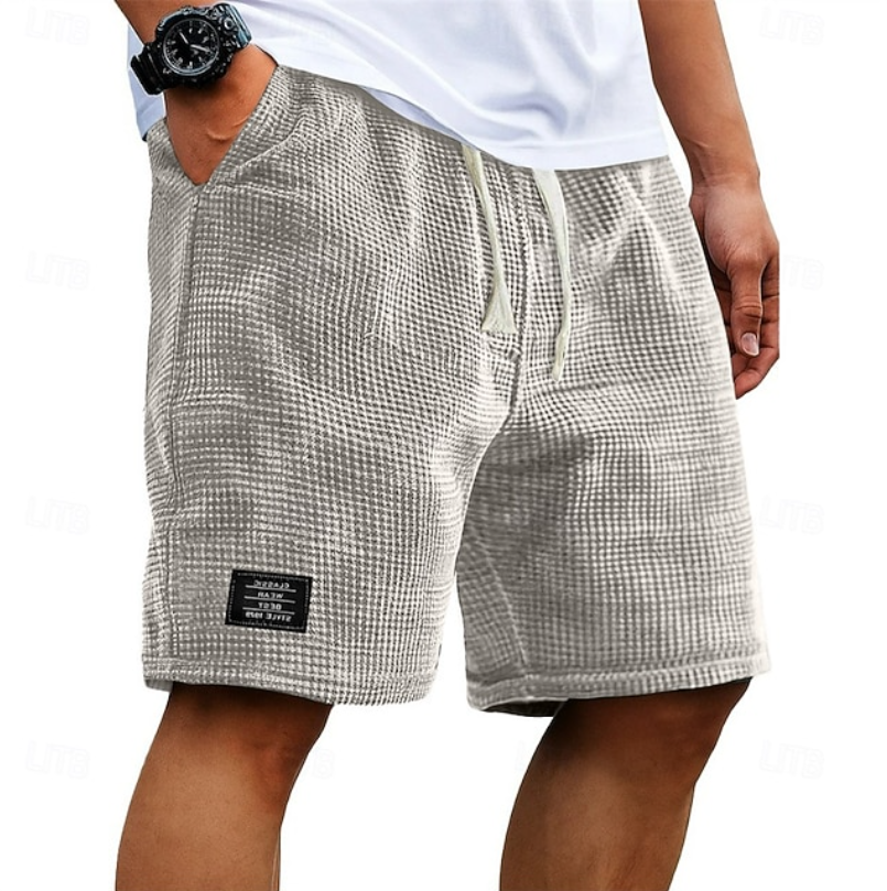 Light grey waffle-knit casual shorts featuring cream drawstring and side pockets