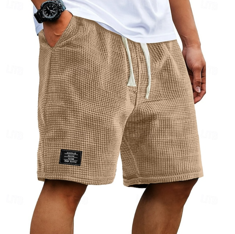 Beige waffle-textured casual shorts with cream drawcord and slanted pockets