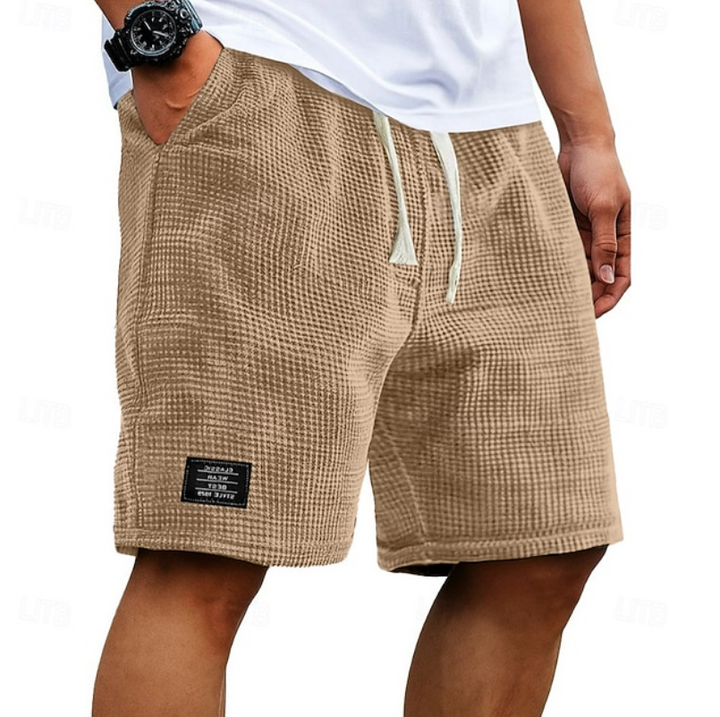 Beige waffle-textured casual shorts with cream drawcord and slanted pockets