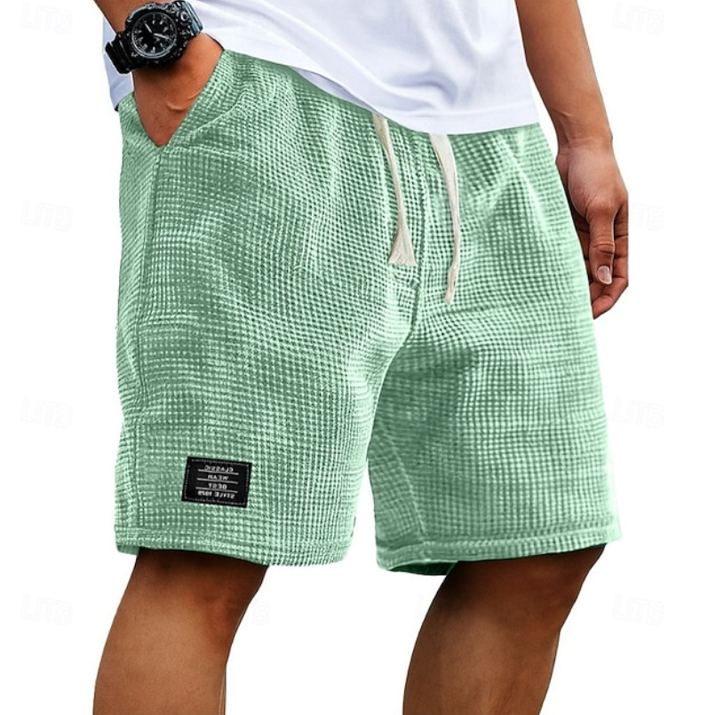 Sage green waffle-knit summer shorts with cream drawstring waistband